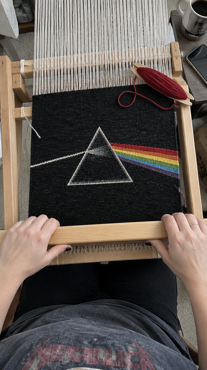Close-up of the Dark Side of the Moon design being woven on a loom
