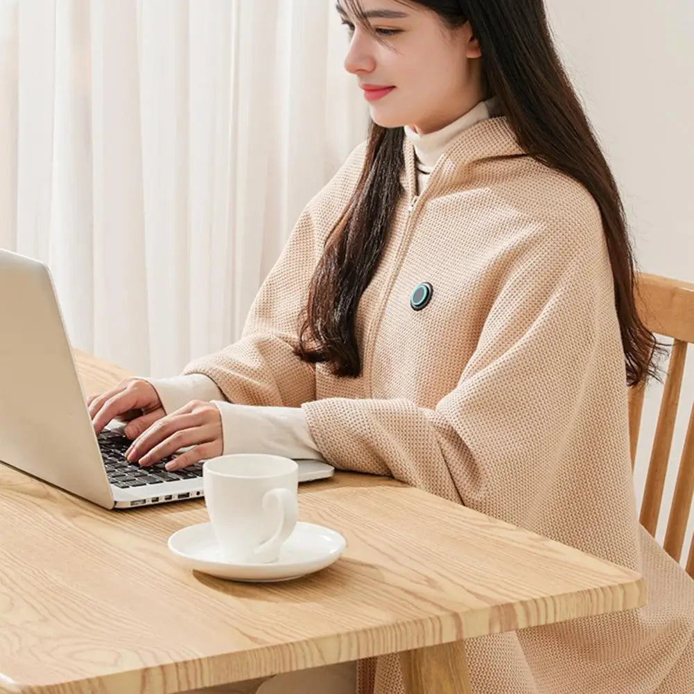 Working at a desk in the heated wearable blanket