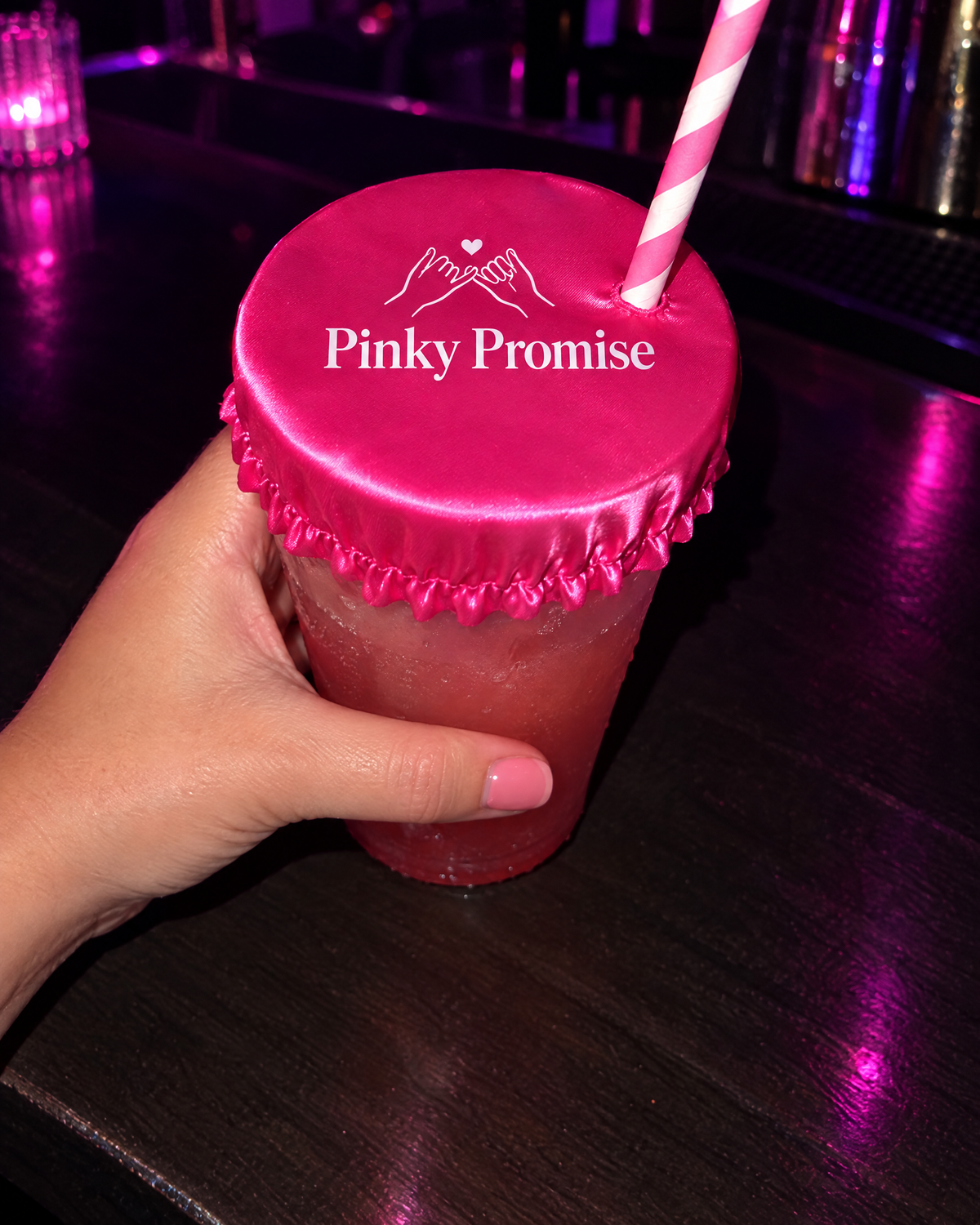 Pinky Promise drink cover on a cup with a straw